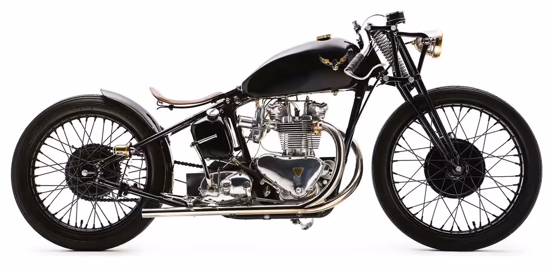 The Bullet, a black custom cafe racer motorcycle by Falcon with spoked wheels, side view