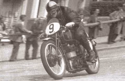 Historic photo of Arthur Lavington racing at the Junior TT, number 9